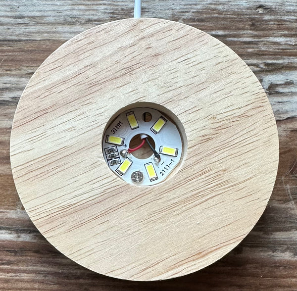 Base de luz tallada en madera de loto